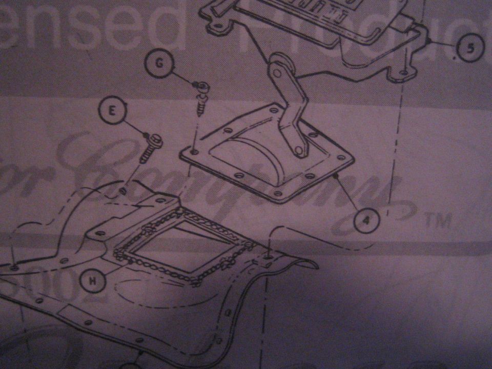 Exploded parts drawing of a shifter/console assembly with lettered callouts E, G, H