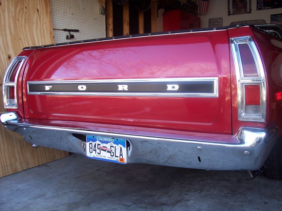 Red Ford Ranchero tailgate with FORD lettering and Colorado collector plate