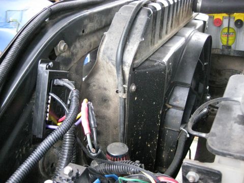 1979 Ford Bronco - Close-up view of an electric fan and its shroud, with visible wiring and radiator components.
