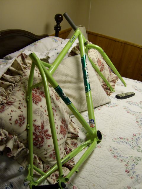 1972 Ford Ranchero - A bicycle frame is shown resting on a bed with floral patterned bedding.