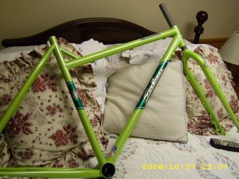 1972 Ford Ranchero - A bicycle frame is displayed on a bed with floral patterned pillows.