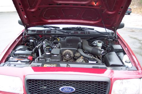 2001 Ford Crown Victoria - Engine bay of a 2001 Ford Crown Victoria, viewed from above with the hood raised.