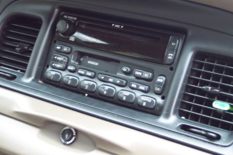 2001 Ford Crown Victoria - Dashboard interior the car's audio system and climate control vents.
