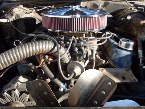 1972 Ford Ranchero - Close-up view of a vehicle's engine bay, an aftermarket air cleaner and cooling fan.