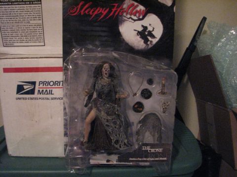 1991 Ford Bronco - A Sleepy Hollow action figure is displayed in its packaging, with postal service boxes nearby.