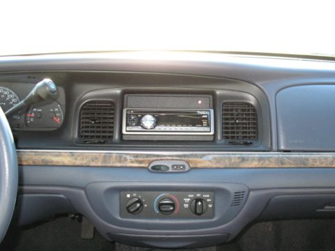 2000 Ford Crown Victoria - Dashboard view of a 2000 Ford Crown Victoria, showing the center console and aftermarket stereo.
