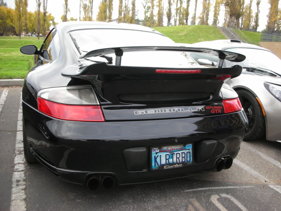 Black Gemballa Biturbo GTR rear view with custom spoiler and dual exhaust