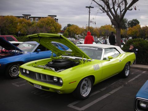 1998 Ford Crown Victoria - Lime green 1970 Plymouth Barracuda convertible at a car show, hood and engine exposed.