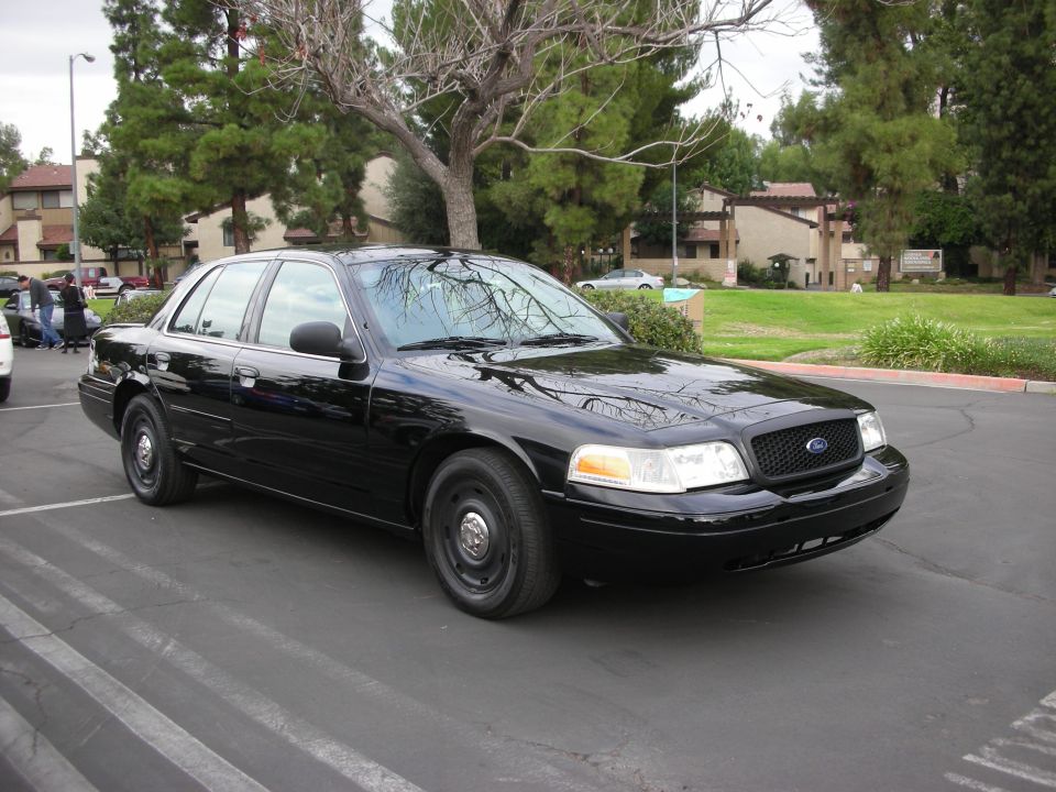 Black 1998 Ford Crown Victoria parked in a lot