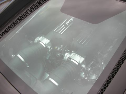 1998 Ford Crown Victoria - Photograph looking through the rear glass at a mid-mounted V8 supercar engine.