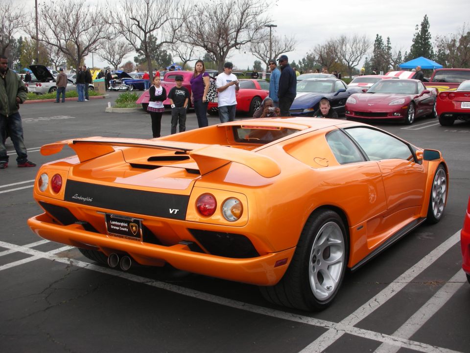 Orange Lamborghini Diablo VT rear quarter view in a parking lot