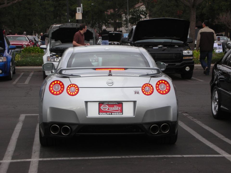 Silver Nissan GT-R rear view with quad exhaust and distinctive taillights