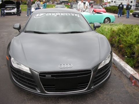 1998 Ford Crown Victoria - A gray Audi R8 is parked at an outdoor event, with a banner on its windshield.