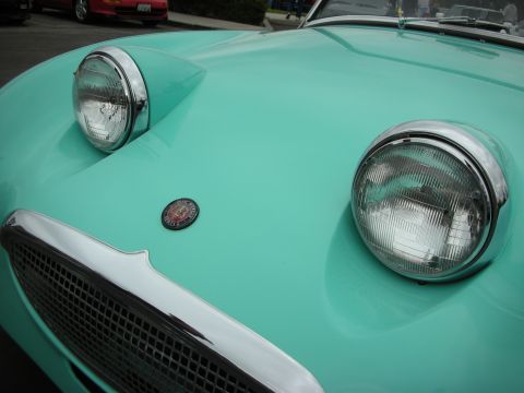 1998 Ford Crown Victoria - The distinctive headlights and grille of a classic Austin-Healey Sprite are shown up close.