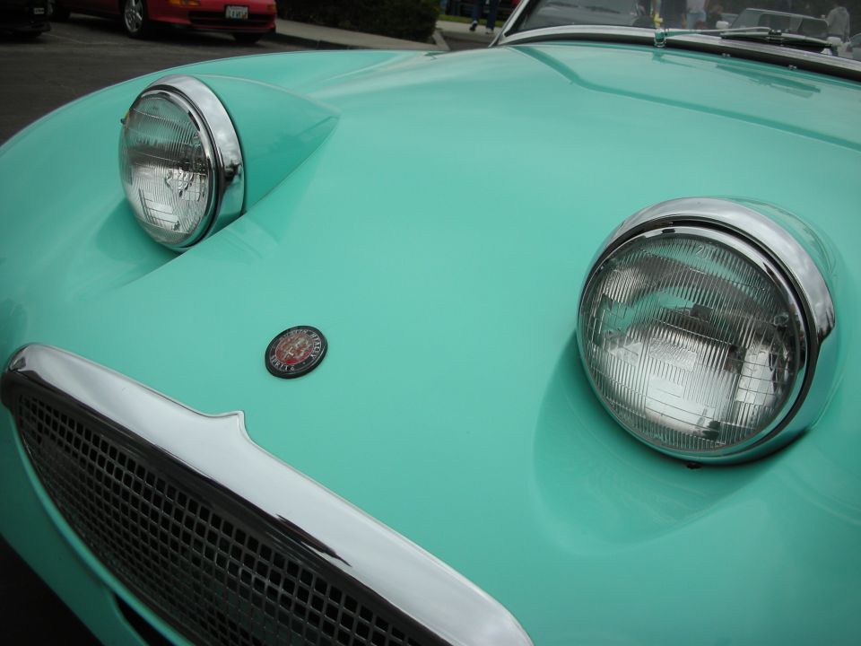 Teal Austin-Healey Sprite front end with headlights and grille