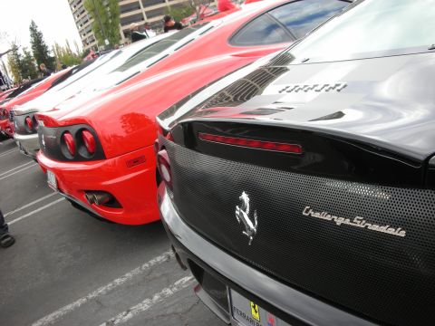 1998 Ford Crown Victoria - Multiple Ferraris parked in a lot, including a black Challenge Stradale and a red 360 Modena.