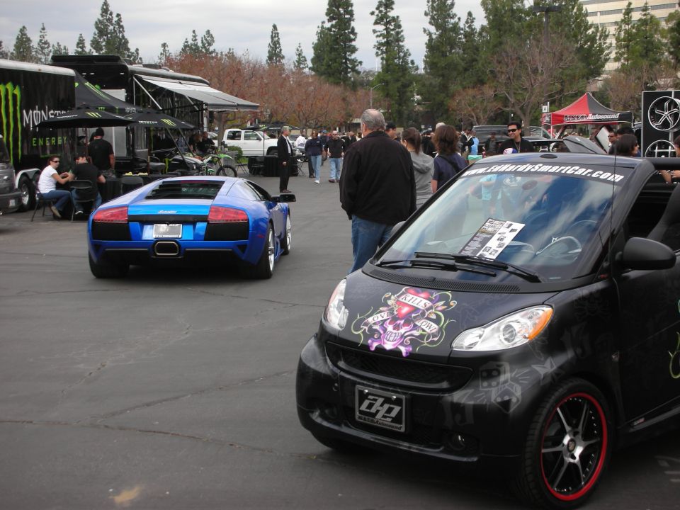 Blue Lamborghini rear view, parked at an outdoor event
