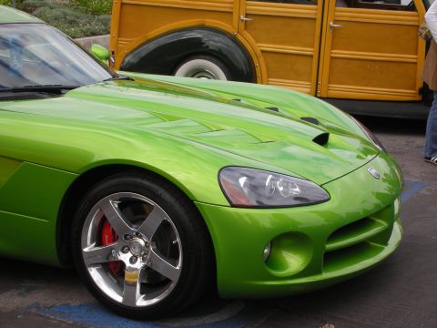 1998 Ford Crown Victoria - A green Dodge Viper is parked in front of a vintage woodie wagon.