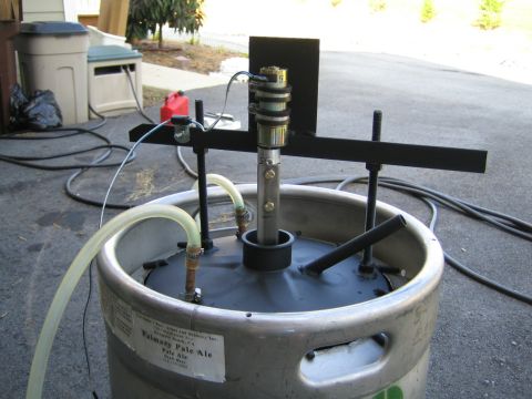 1985 Ford LTD Crown Victoria - Photograph of a homebrewing setup on a converted keg, not a technical document.