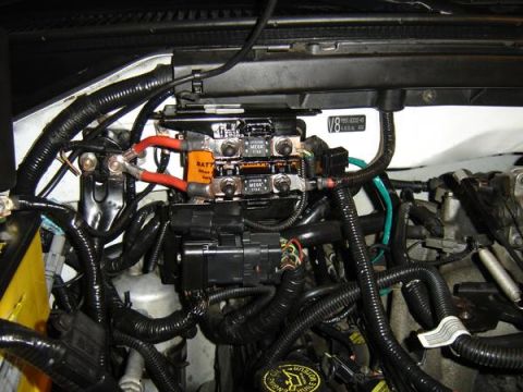 2007 Ford Mustang - Engine-bay photograph of a power distribution/fuse box, not a technical document.