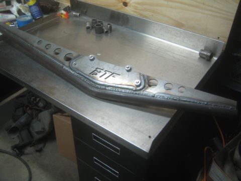 1990 Ford Bronco - Photograph of a fabricated steel frame member with welded FTF gusset plate, not a technical document.
