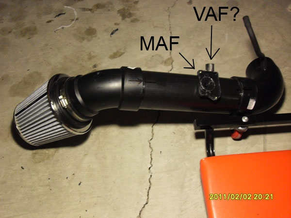 Cold air intake tube with cone filter labeled MAF and VAF on floor