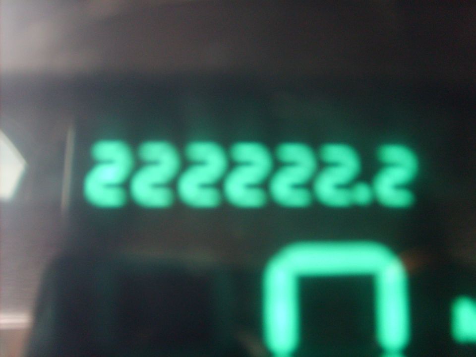 Digital odometer showing 222222.2 miles with a U-shaped indicator light.