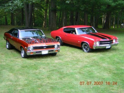1972 Ford Ranchero - Two classic muscle cars, a red Chevrolet Chevelle SS with black stripes and an orange Chevrolet Nova SS with flame graphics, are parked on…