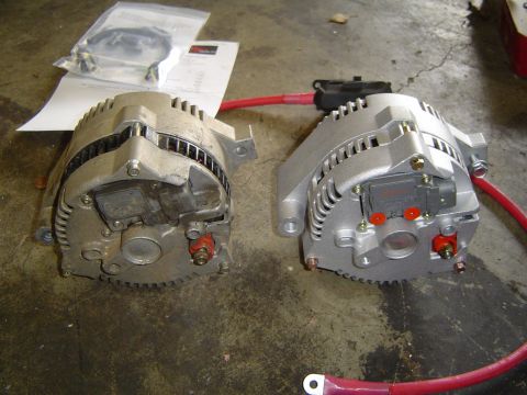 1989 Ford Bronco - Comparison of a used alternator next to a new one, with installation instructions visible.