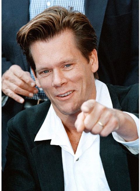 1996 Ford Bronco - This photo shows actor Kevin Bacon pointing directly at the camera with a smile.