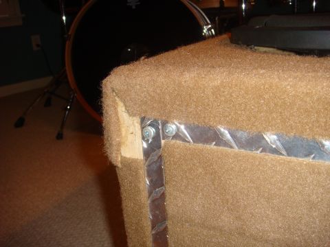 1996 Ford Bronco - A close-up of a speaker enclosure corner, showing its construction details.