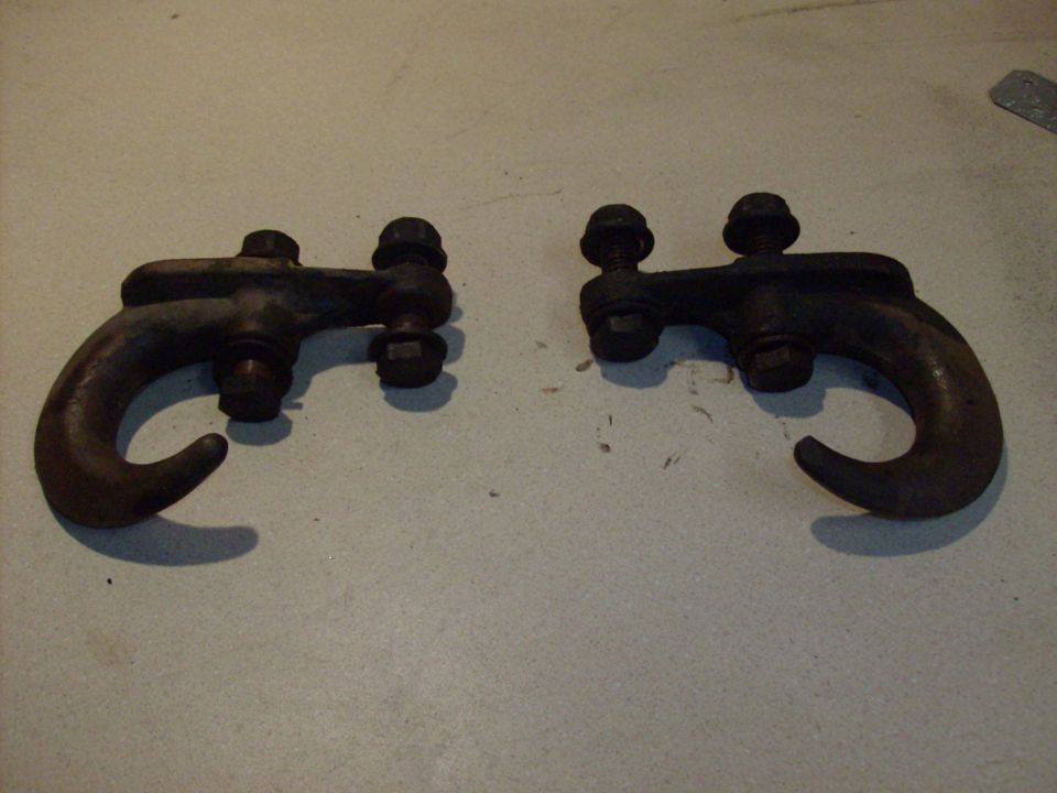 pair of old tow hooks with bolts