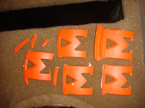 1996 Ford Bronco - These orange plastic clips appear to be broken or damaged, with some pieces scattered around.