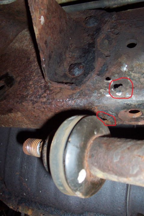 1990 Ford Bronco - The rot holes are circled in red