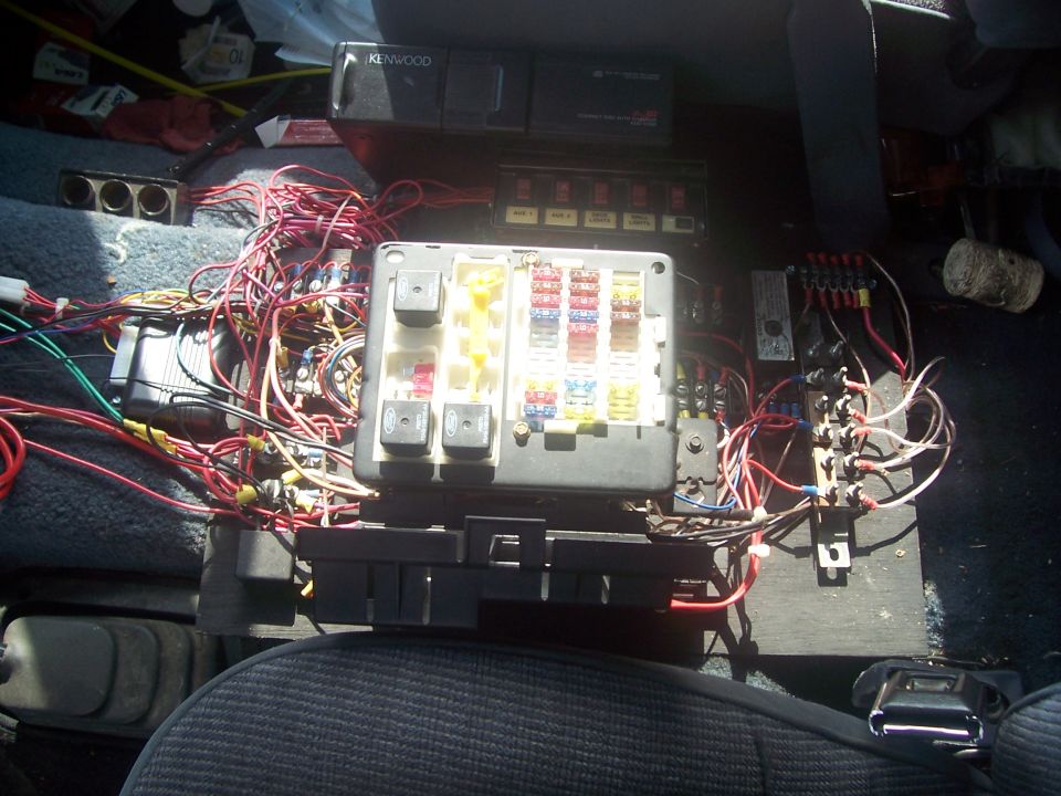 In the center, you are looking at an accessory fuse panel out of an 04 Crown Vic Police car.

On the right side of this pic there are 6 breakers for the overhead off road lights.