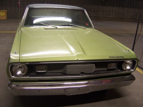 1979 Ford Bronco - A light green Plymouth Duster is shown from the front, with a chrome bumper and grille.