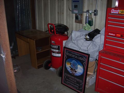 1979 Ford Bronco - A red Husky air compressor and a red Eddlebrock tool chest are visible in a cluttered garage setting.