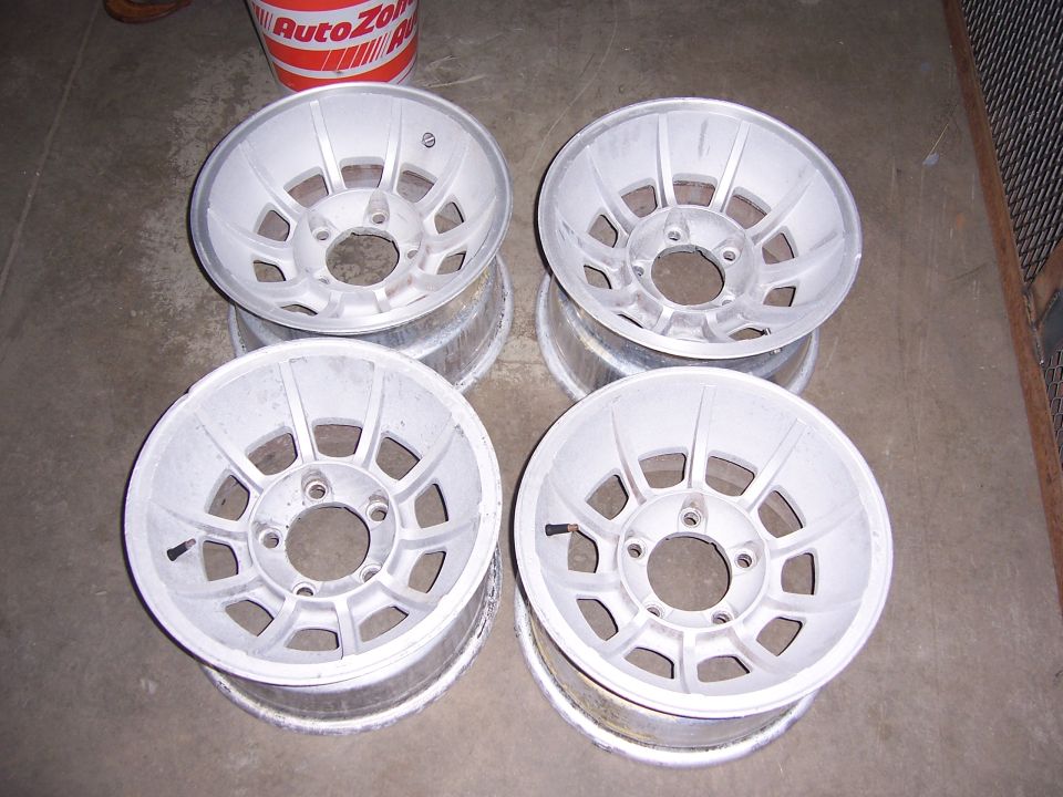 four aluminum alloy wheels stacked