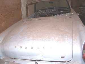 1965 Ford Mustang - Front view of a Sunbeam car with its hood script visible.
