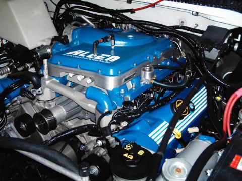 2007 Ford Mustang - Photograph of an engine bay with aftermarket intake, not a technical document.