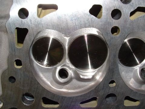 2007 Ford Mustang - Photograph of a cylinder head's combustion chambers, not a technical document.