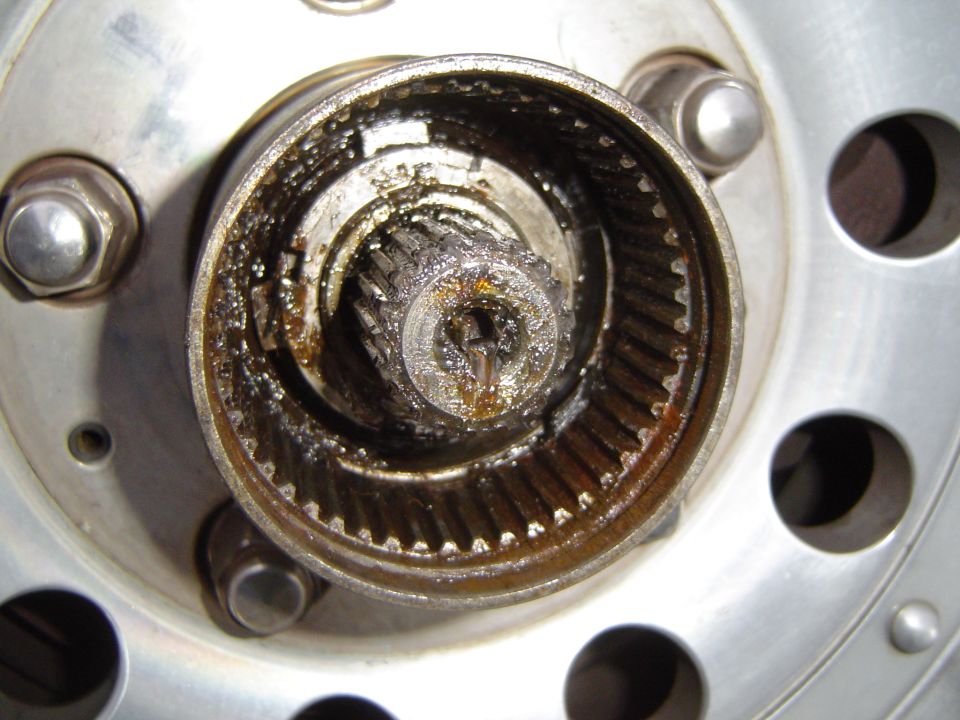 There is a small c clip and a splined washer that come out as well then you are ready for the new hub