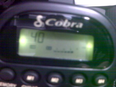 2008 Jeep Wrangler - A close-up view of a Cobra CB radio display showing channel 40. The radio is mounted in a vehicle, as indicated by the buttons labeled 'M1'…