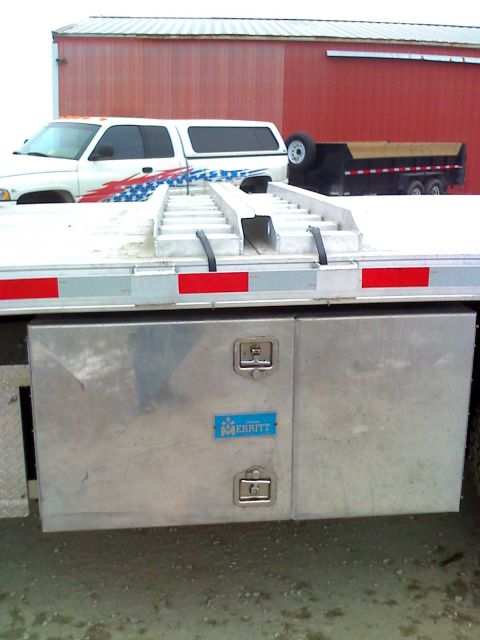 1992 Ford Bronco - Photograph of a flatbed truck's rear toolboxes, not a technical document.