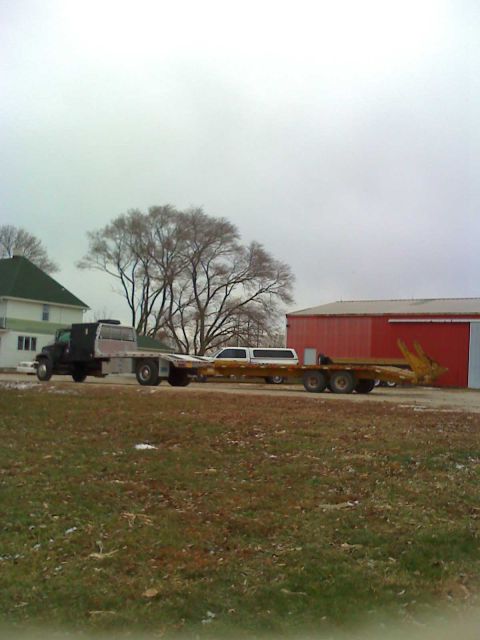 1992 Ford Bronco - Photograph of a truck and trailer outdoors, not a technical document.