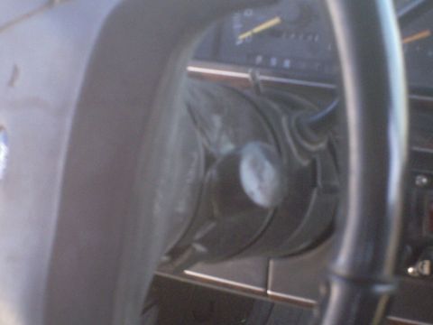1991 Ford Bronco - Interior view of a vehicle's dashboard and steering column, showing part of the instrument cluster and a portion of the steering wheel.