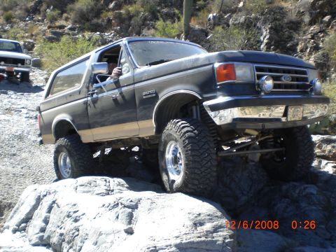 1991 Ford Bronco - This 1991 Ford Bronco is navigating a rocky trail, its off-road capabilities.