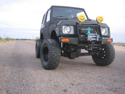 1987 Suzuki Samurai - This Suzuki Samurai has been heavily modified with large off-road tires and a front winch.