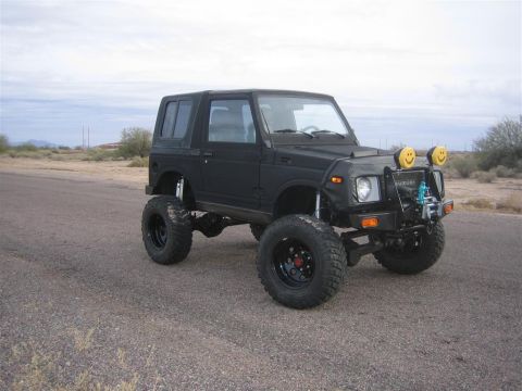 1987 Suzuki Samurai - This modified Suzuki Samurai sits high on its suspension, ready for off-road adventures.