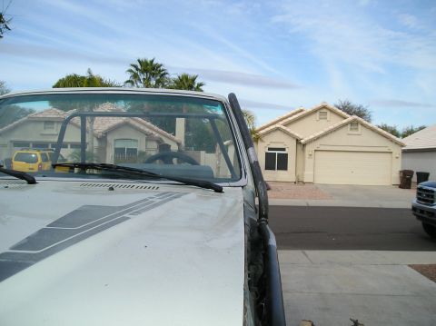 1986 Toyota Hilux - Front view of a 1986 Toyota Hilux, showing the snorkel and interior roll cage.